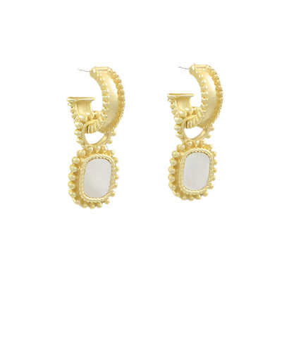 Gold hoop earrings with white stones on a gray background